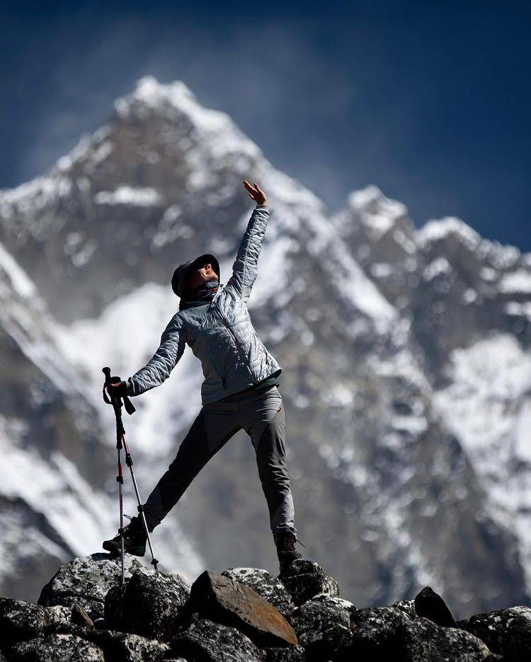Trekkers hiking with Ama Dablam mountain in the background on the Everest Base Camp trail